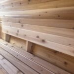 Full-length wooden backrests inside SaunaSpa barrel sauna for enhanced comfort and ergonomic support.