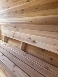 Full-length wooden backrests inside SaunaSpa barrel sauna for enhanced comfort and ergonomic support.