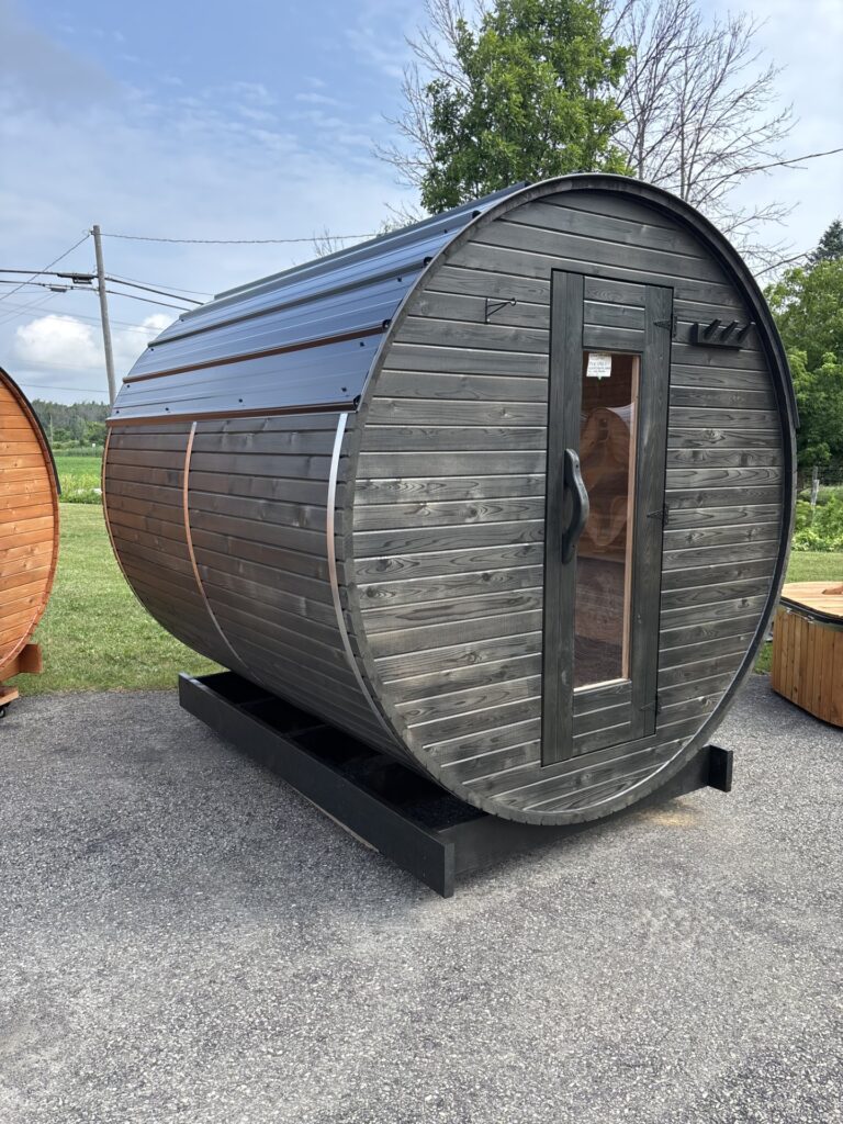 Modern outdoor barrel sauna with glass front door