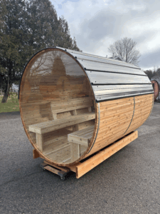 Modern outdoor wooden sauna by Saunaspa in Canada featuring a full 10 mm tempered glass front panel