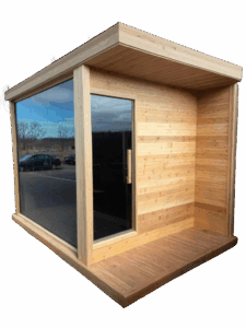 Outdoor red cedar sauna with large tinted glass window and door, surrounded by nature.